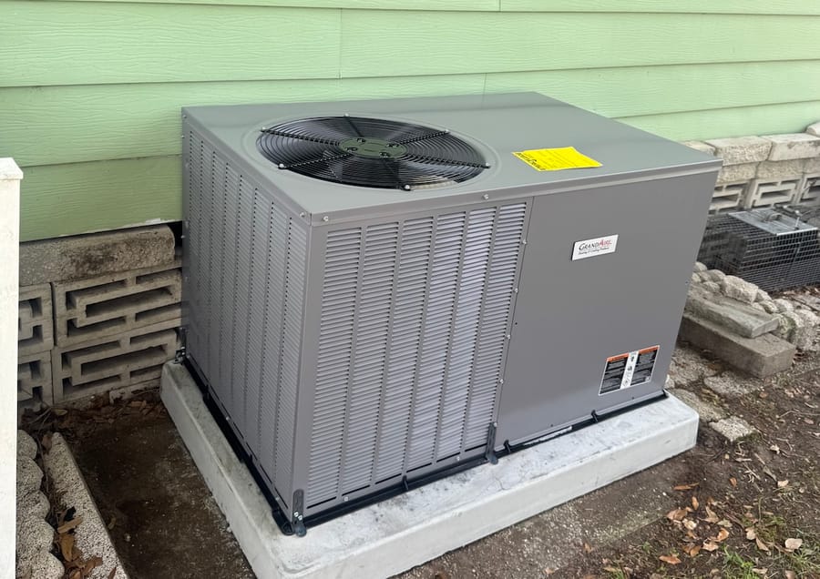 AC unit installed outside house.