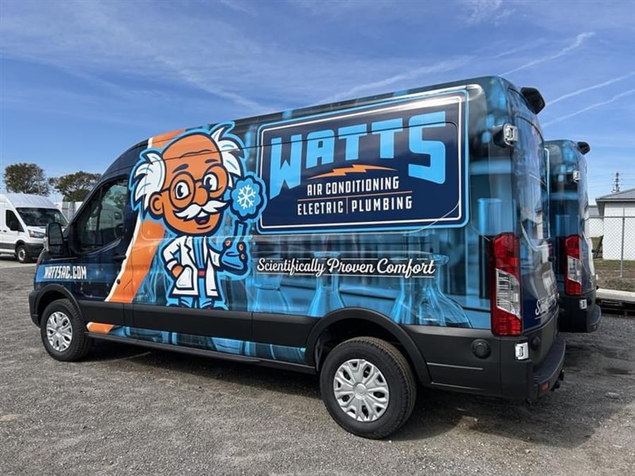 Watts van parked in front of commercial business.